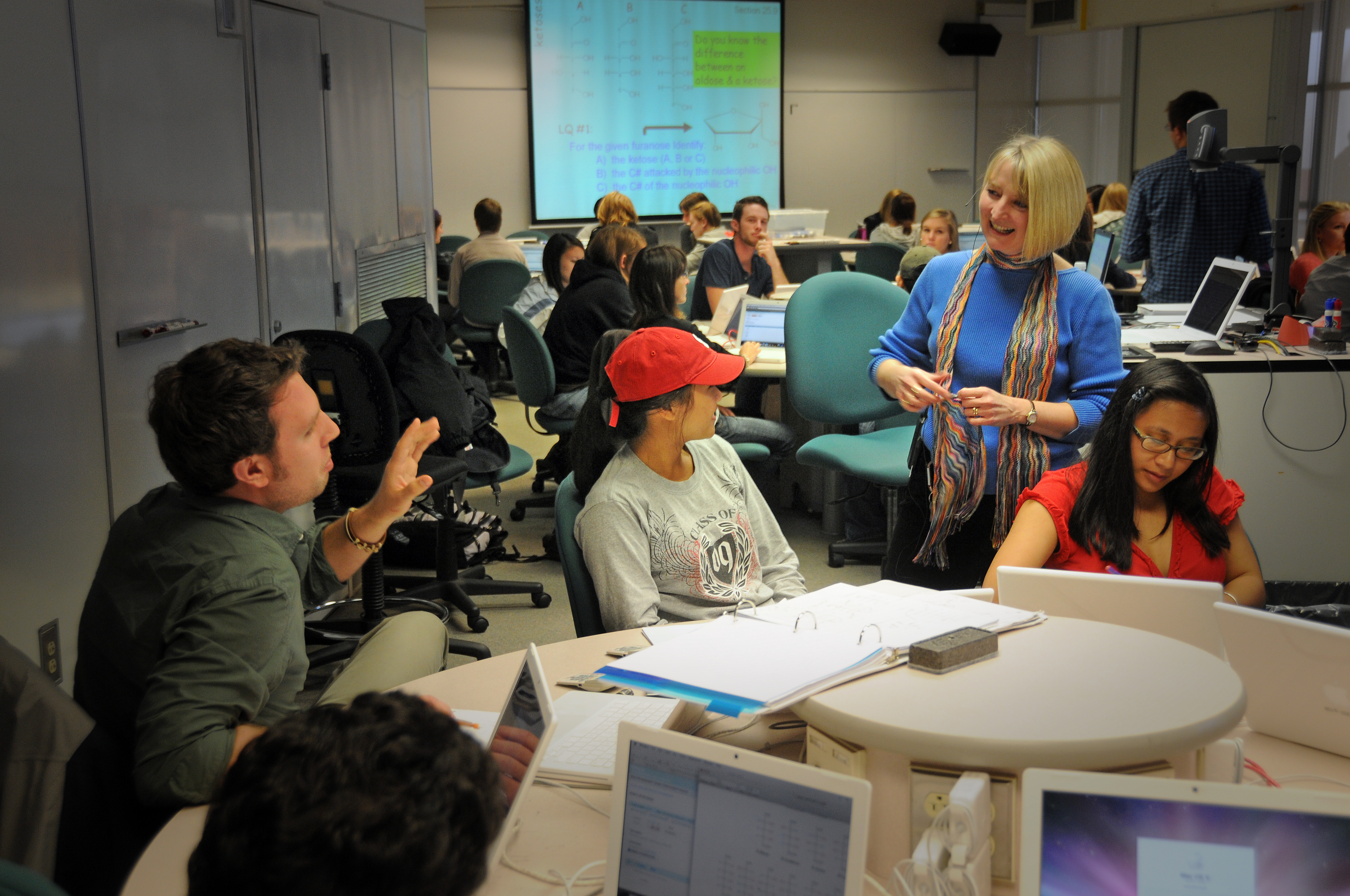 Student asks a question of PAMS professor Kay Sandberg in Scale-Up class.